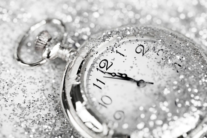 An old pocket watch with droplets of water