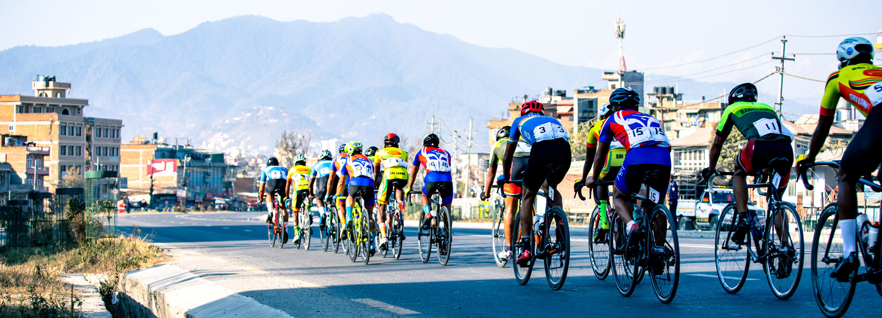 Cyclcists racing ina city